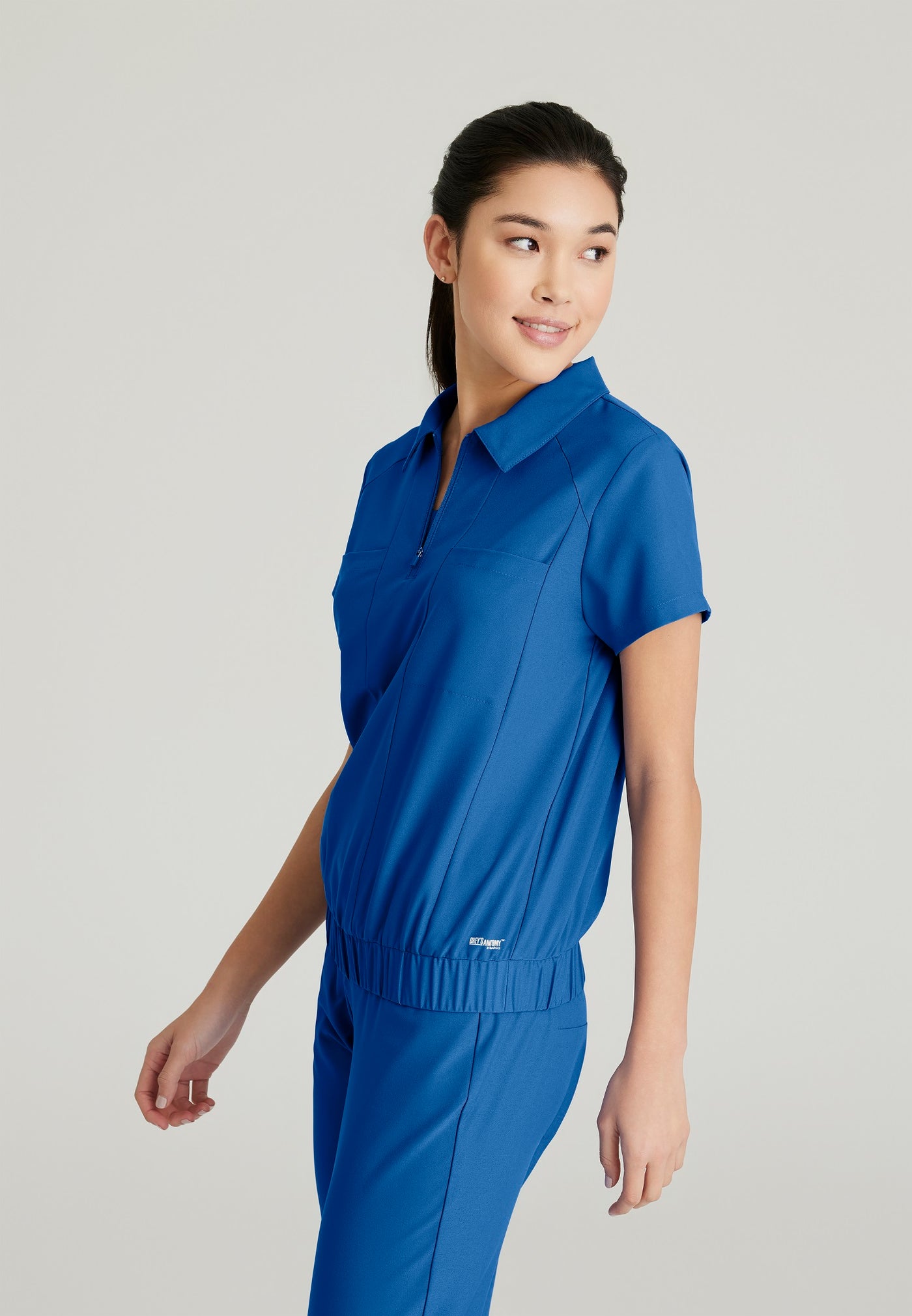 GSST215 Grey's Anatomy Scrub Evolve Perseverance Zip Neck Banded Waist  Scrub Top (XXS - 3XL)