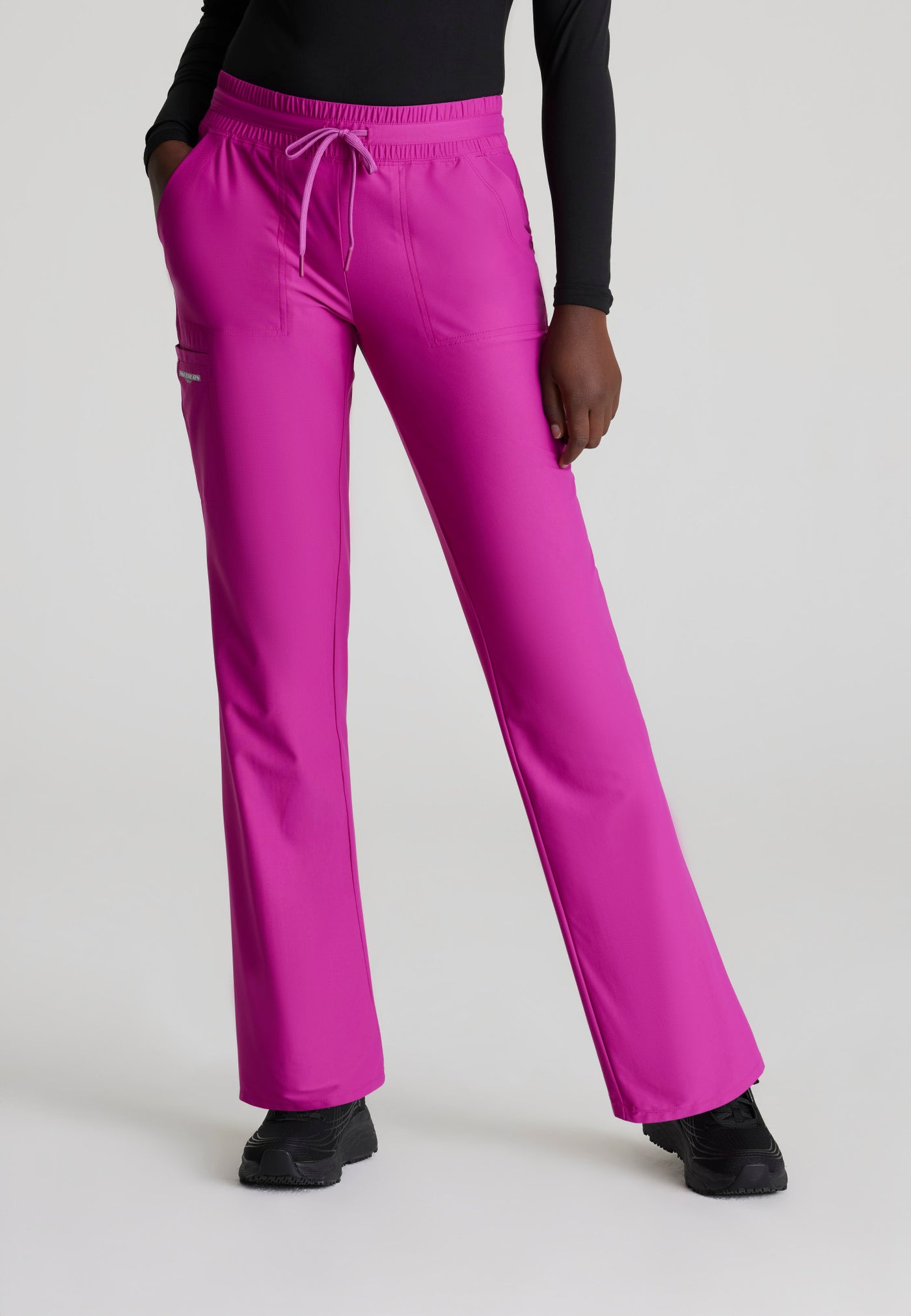 SKP668 Skechers Slip-Ins scrub pant in deep magenta. slim leg. stretchable fabric. medical scrub pants. close up image