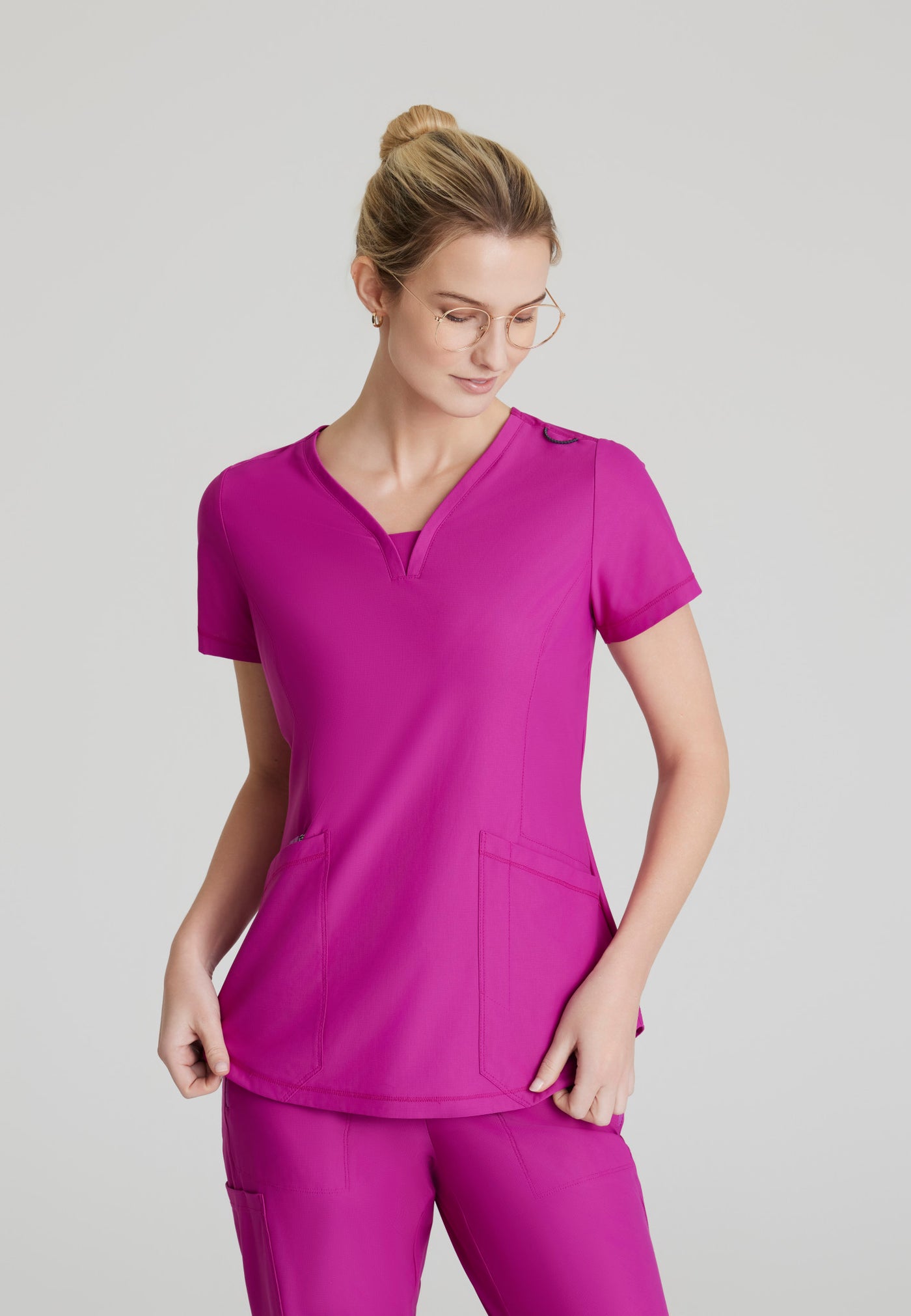 SKT220 Skechers Slip-Ins scrub top in deep magenta. three pockets.  women's scrub uniforms. stretchable fabric. front image