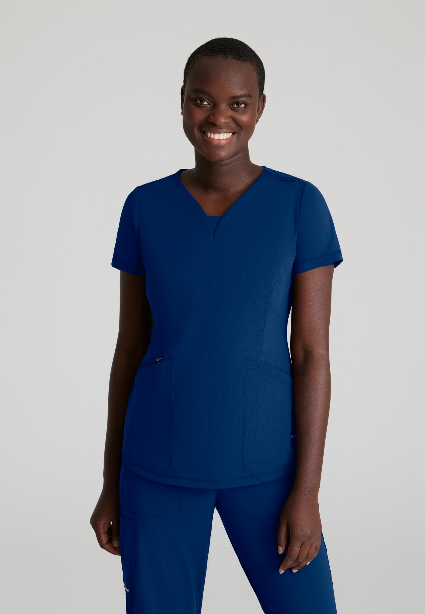 SKT220 Skechers Slip-Ins scrub top in Navy. three pockets. stretchable fabric. front image