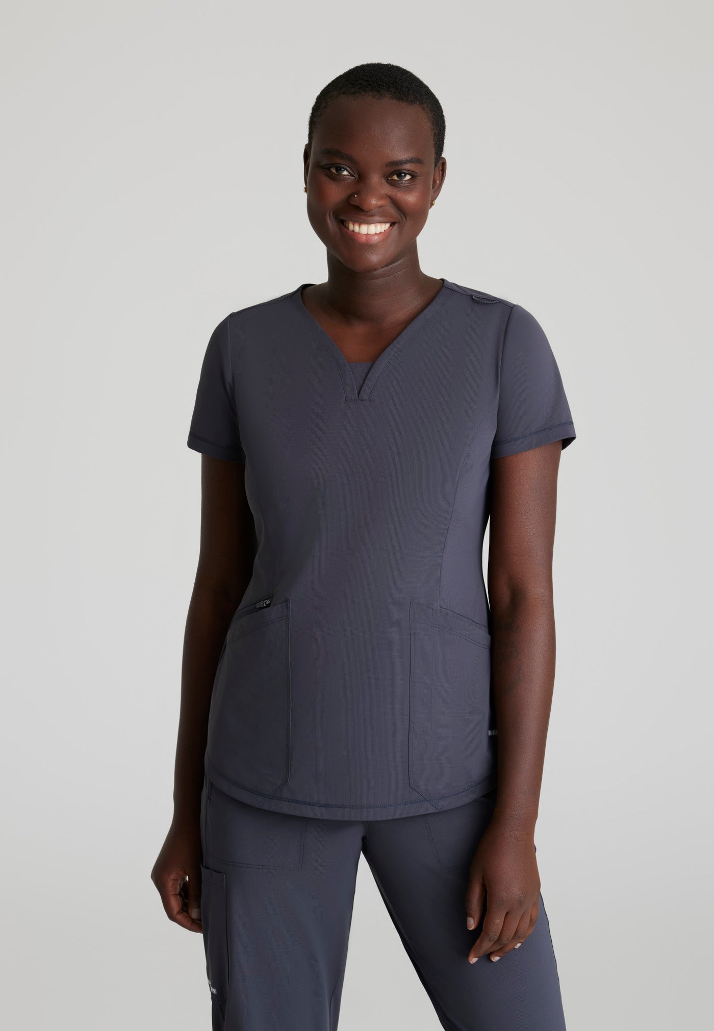 SKT220 Skechers Slip-Ins scrub top in Pewter. three pockets. stretchable fabric. front image