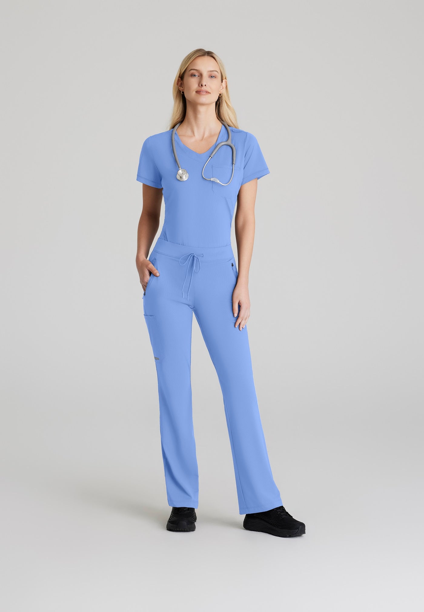 SKT221 Skechers Slip-Ins scrub top in ceil. tuckable. one top pocket. women's. stretchable fabric. full body image