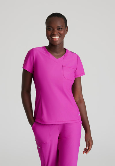 SKT221 Skechers Slip-Ins scrub top in deep magenta. tuckable. one top pocket. women's scrub uniforms. stretchable fabric. front image