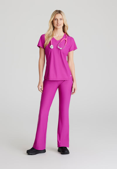 SKT221 Skechers Slip-Ins scrub top in deep magenta. tuckable. one top pocket. women's scrub uniforms. stretchable fabric. figs tops. full body image